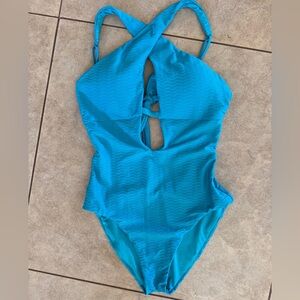 BECCA Vibes Tessa Texture Cross-Over High Neck One Piece in Gulf Blue Size M